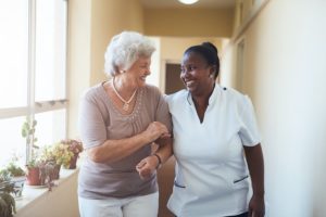 Oral Health and Cancer: Dental professional holding her patient's hand. Prevent and Treat Oral Mucositis: Oral mucositis is a common side effect of radiation treatment and chemotherapy.